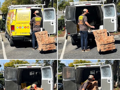 Man loading a recliner into a van