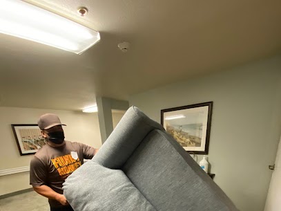 Man moving a couch
