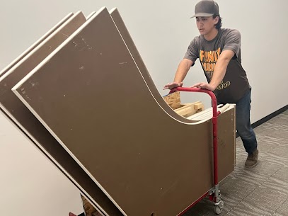 Man removing furniture with a cart