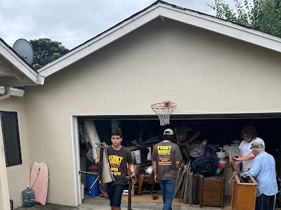 People cleaning out a garage